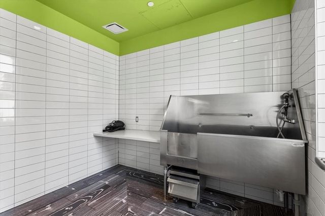 a living room with couches and a flat screen tv