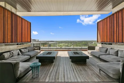 a view of a terrace with couches and potted plants