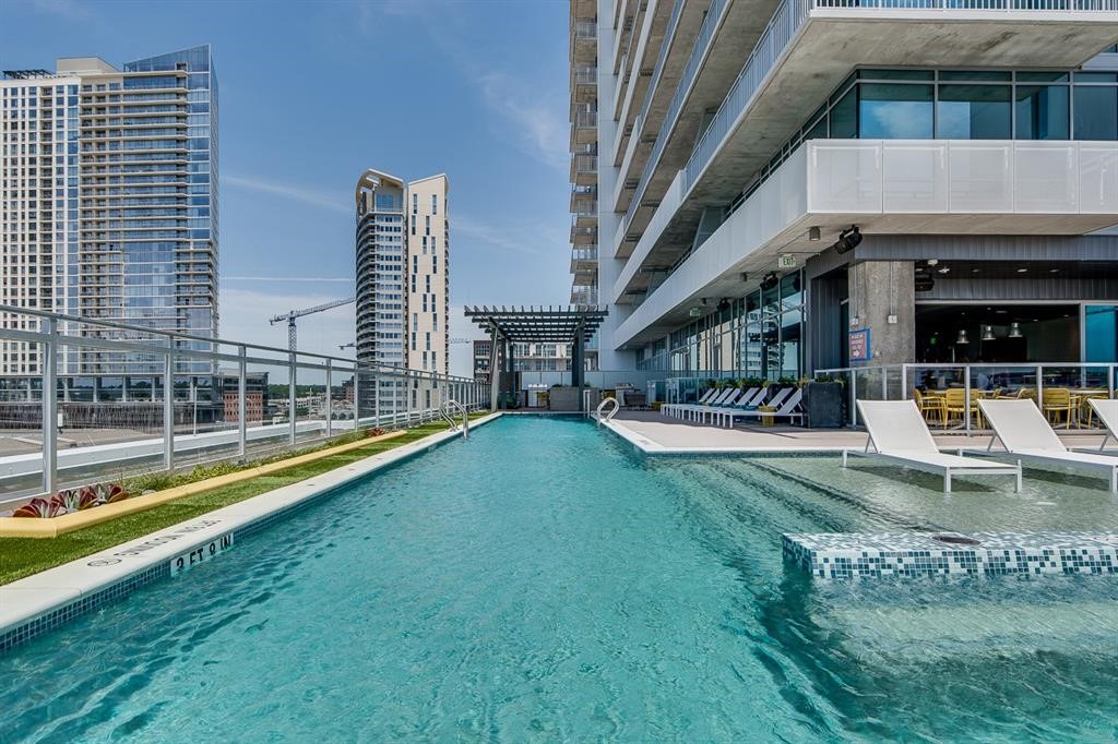 222 West Avenue, Unit 2403 Austin, TX 78701 - Photo 25 of 38 a view of a swimming pool with a patio