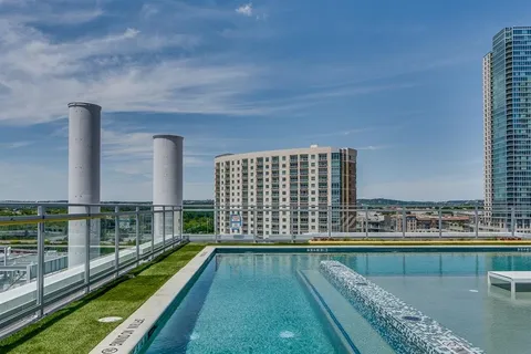 a front view of a building with retail shop and windows