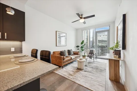a bedroom with a bed and a potted plant