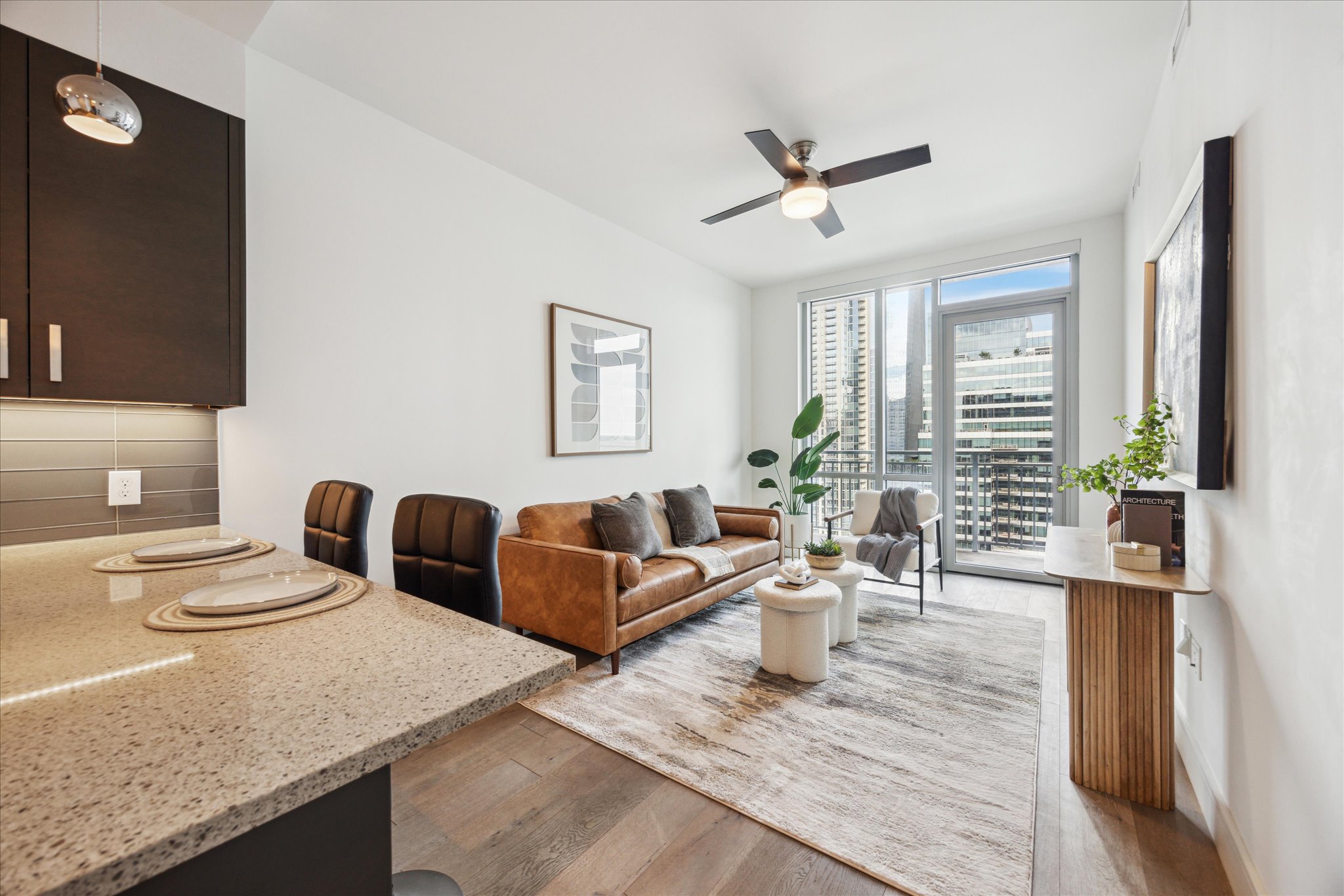 222 West Avenue, Unit 2403 Austin, TX 78701 - Photo 4 of 38 a living room with furniture and a window