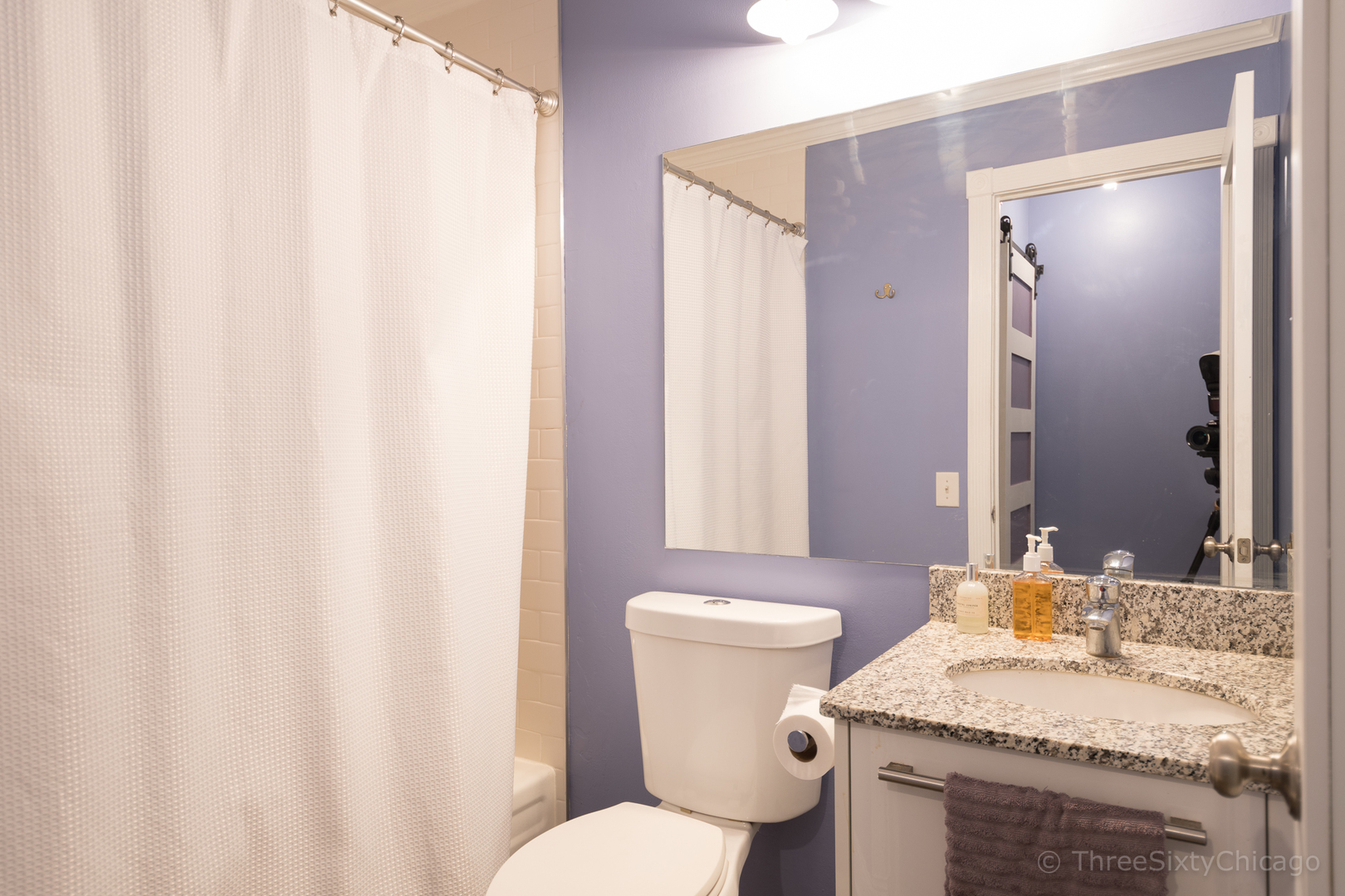 640 South Federal Street, Unit 504 Chicago, IL 60605 - Photo 7 of 13 a bathroom with a granite countertop sink toilet and mirror