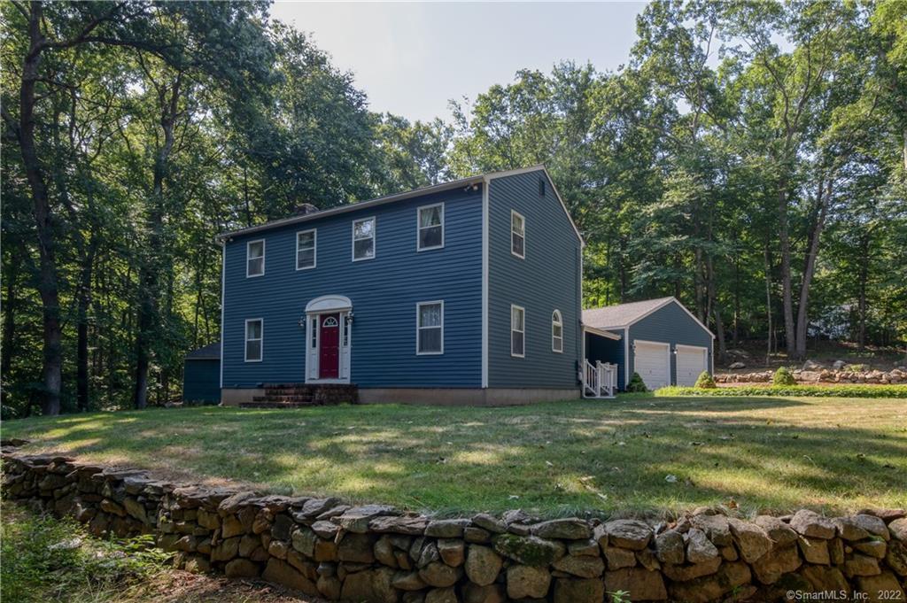 9 Marion Road Bethany, CT 06524 - Photo 1 of 1 a house view with a big yard and large trees