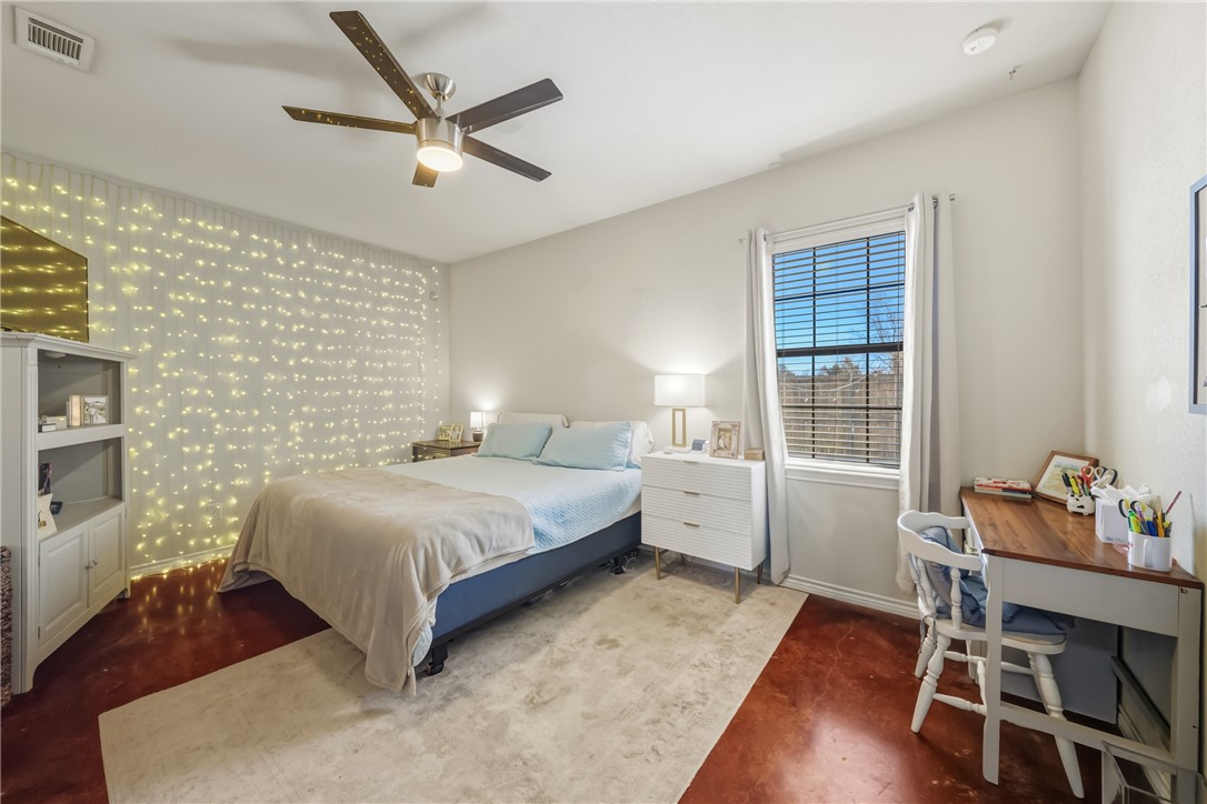3205 Corporal Road College Station, TX 77845 - Photo 12 of 29 a bedroom with a bed and a table in it