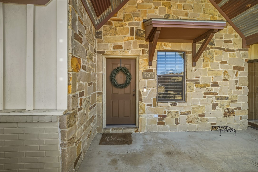 3205 Corporal Road College Station, TX 77845 - Photo 2 of 29 a view of a door and brick wall