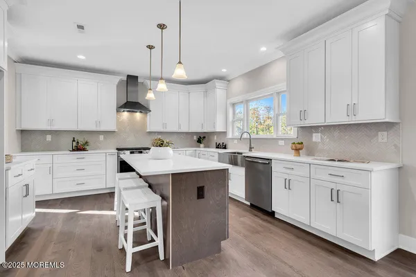 a view of an empty room with windows