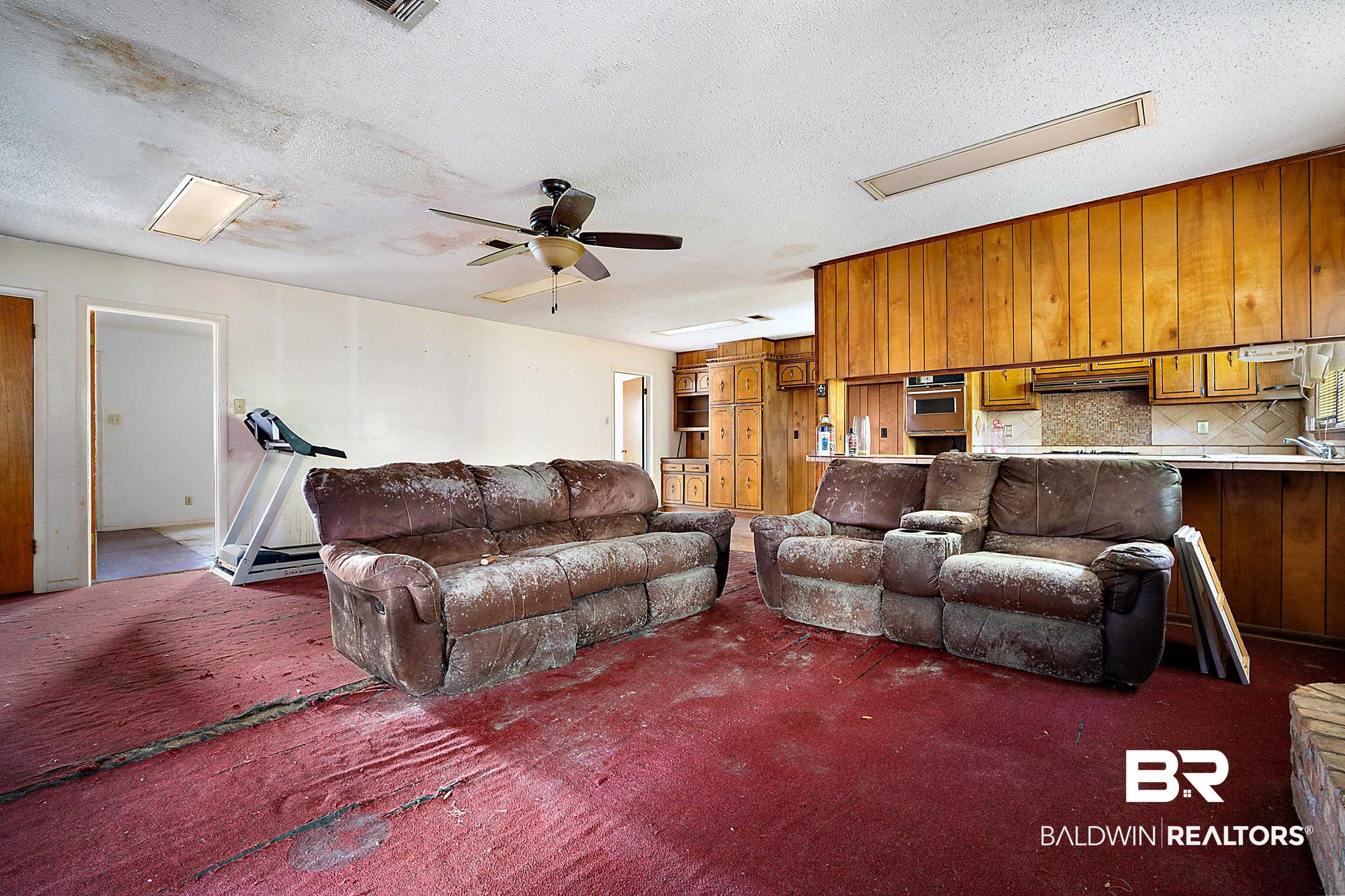 576 Markham Drive Mobile, AL 36609 - Photo 7 of 18 Living area featuring carpet flooring, a ceiling fan, and a textured ceiling