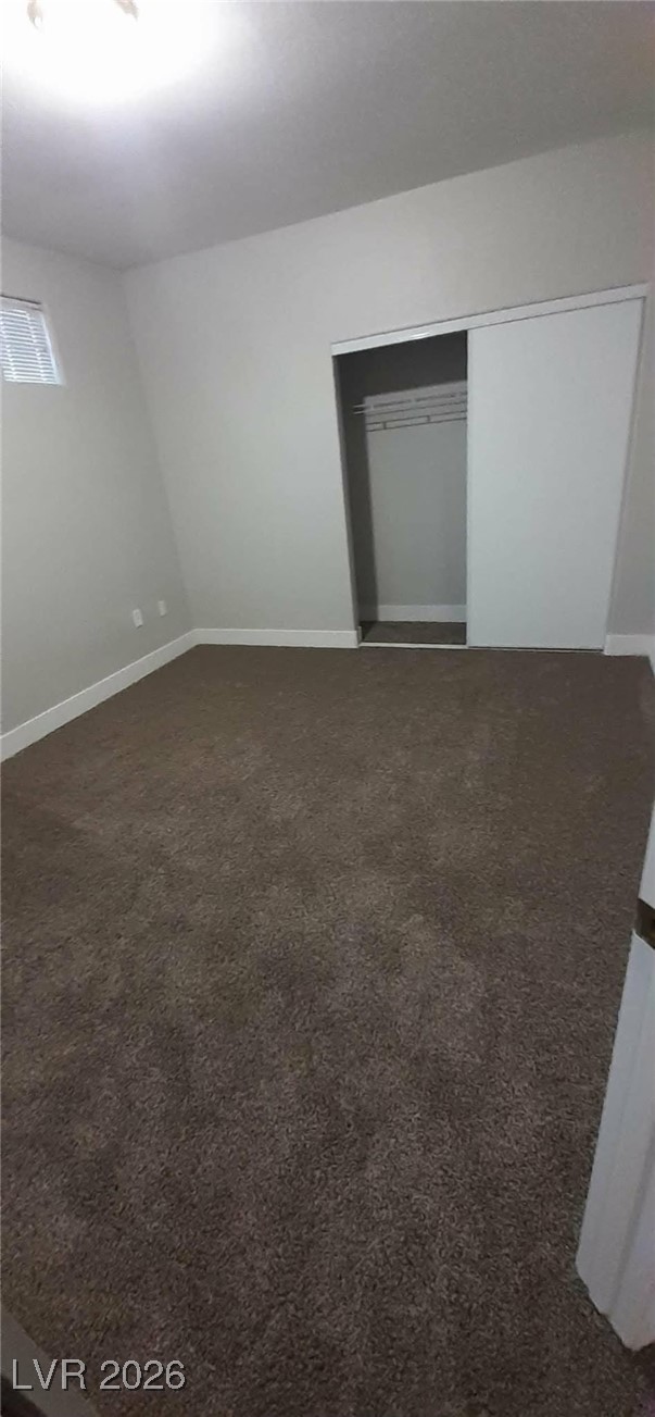 8555 West Russell Road, Unit 2018 Las Vegas, NV 89113 - Photo 15 of 31 Unfurnished room with dark carpet and baseboards