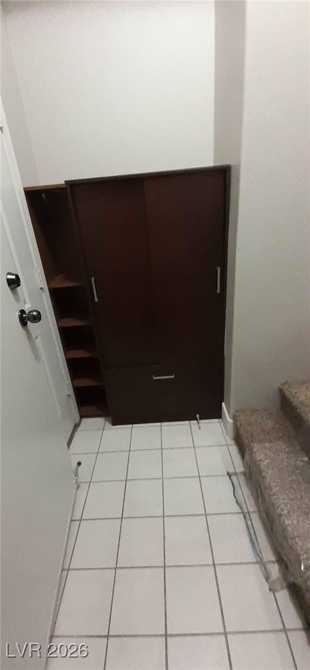 8555 West Russell Road, Unit 2018 Las Vegas, NV 89113 - Photo 18 of 31 Hall featuring light tile patterned floors