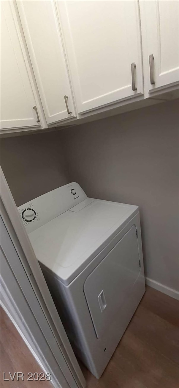 8555 West Russell Road, Unit 2018 Las Vegas, NV 89113 - Photo 21 of 31 Laundry room featuring cabinet space, washer / clothes dryer, and light wood-style flooring