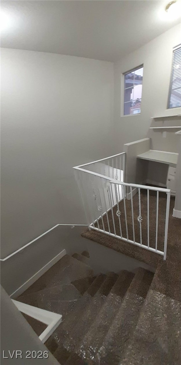 8555 West Russell Road, Unit 2018 Las Vegas, NV 89113 - Photo 23 of 31 Stairs with baseboards