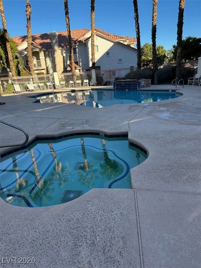 8555 West Russell Road, Unit 2018 Las Vegas, NV 89113 - Photo 27 of 31 Community pool featuring a patio and a community hot tub