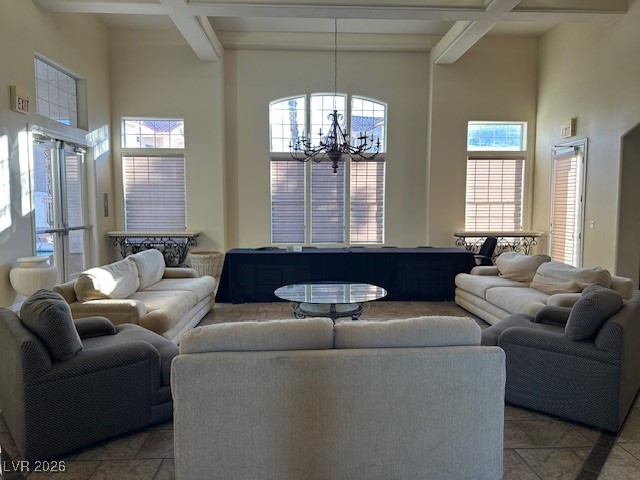 8555 West Russell Road, Unit 2018 Las Vegas, NV 89113 - Photo 30 of 31 Living area with beamed ceiling, a towering ceiling, a chandelier, and coffered ceiling
