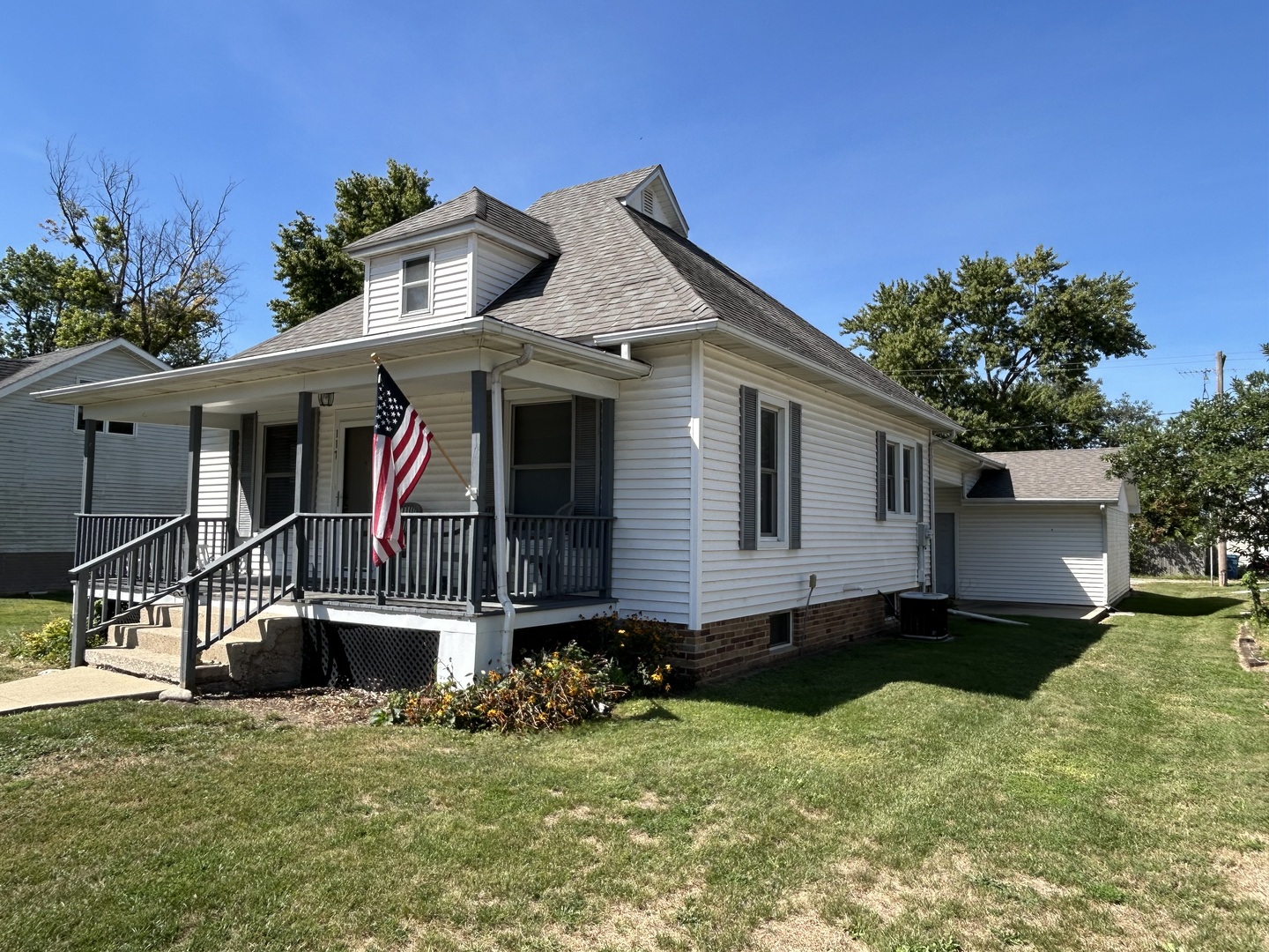 a view of house with yard and entertaining space