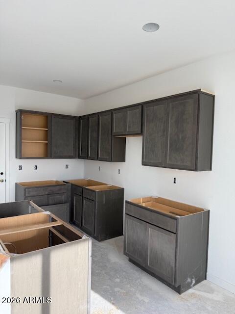 648 South Del Rancho Mesa, AZ 85208 - Photo 3 of 5 a kitchen with stainless steel appliances kitchen island granite countertop a refrigerator and a stove top oven