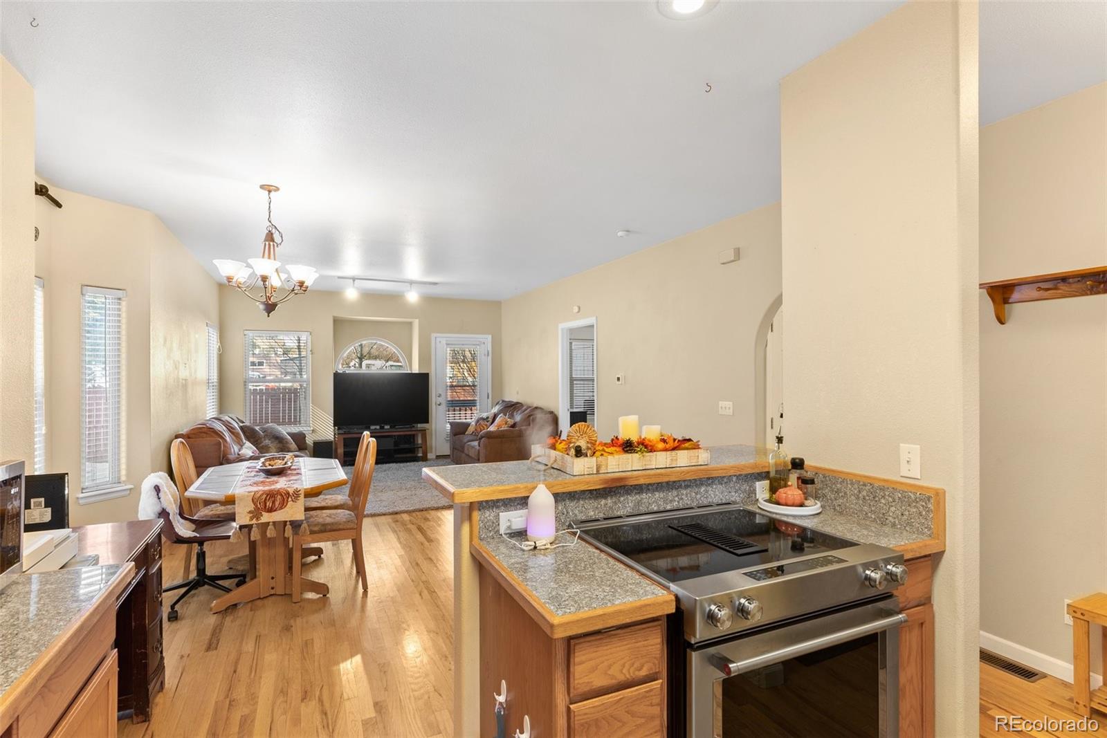 5720 County Road 64, Unit 101A Bailey, CO 80421 - Photo 12 of 46 a view of a dining room with furniture and a chandelier