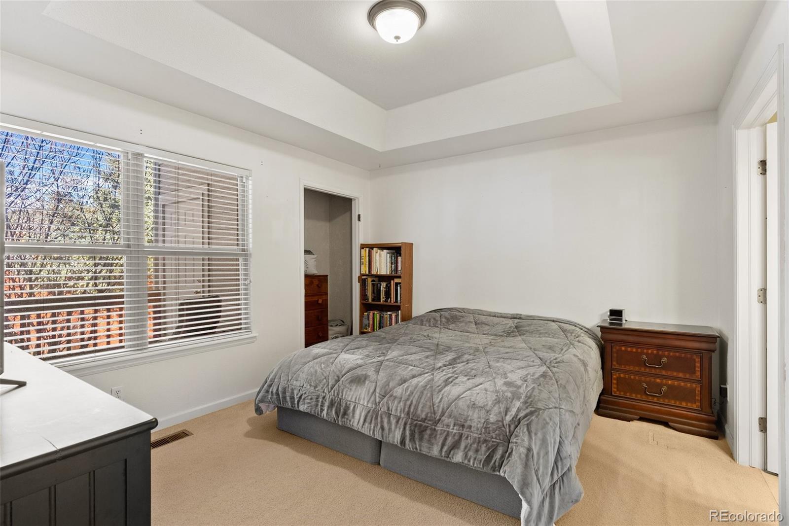 5720 County Road 64, Unit 101A Bailey, CO 80421 - Photo 17 of 46 a bedroom with a bed and a dresser