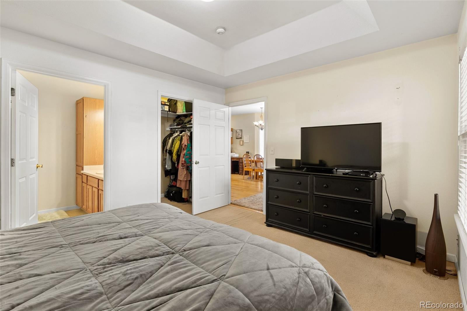 5720 County Road 64, Unit 101A Bailey, CO 80421 - Photo 18 of 46 a bedroom with a bed and a flat screen tv