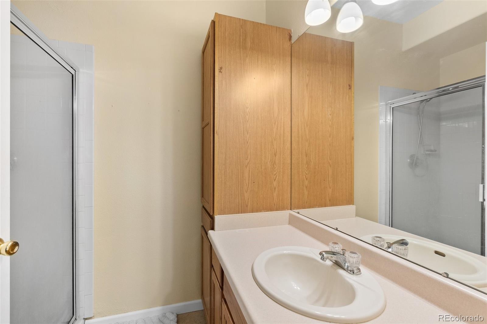 5720 County Road 64, Unit 101A Bailey, CO 80421 - Photo 19 of 46 a bathroom with a sink and a mirror
