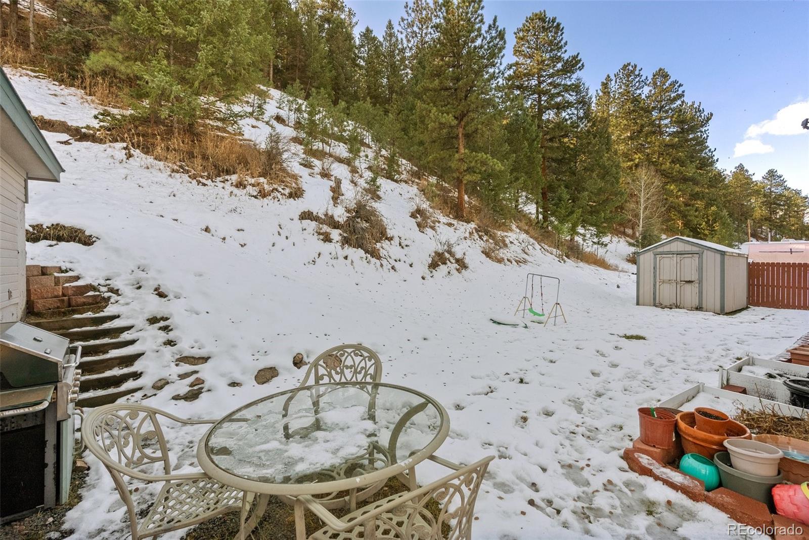 5720 County Road 64, Unit 101A Bailey, CO 80421 - Photo 22 of 46 a terrace of a house with outdoor seating