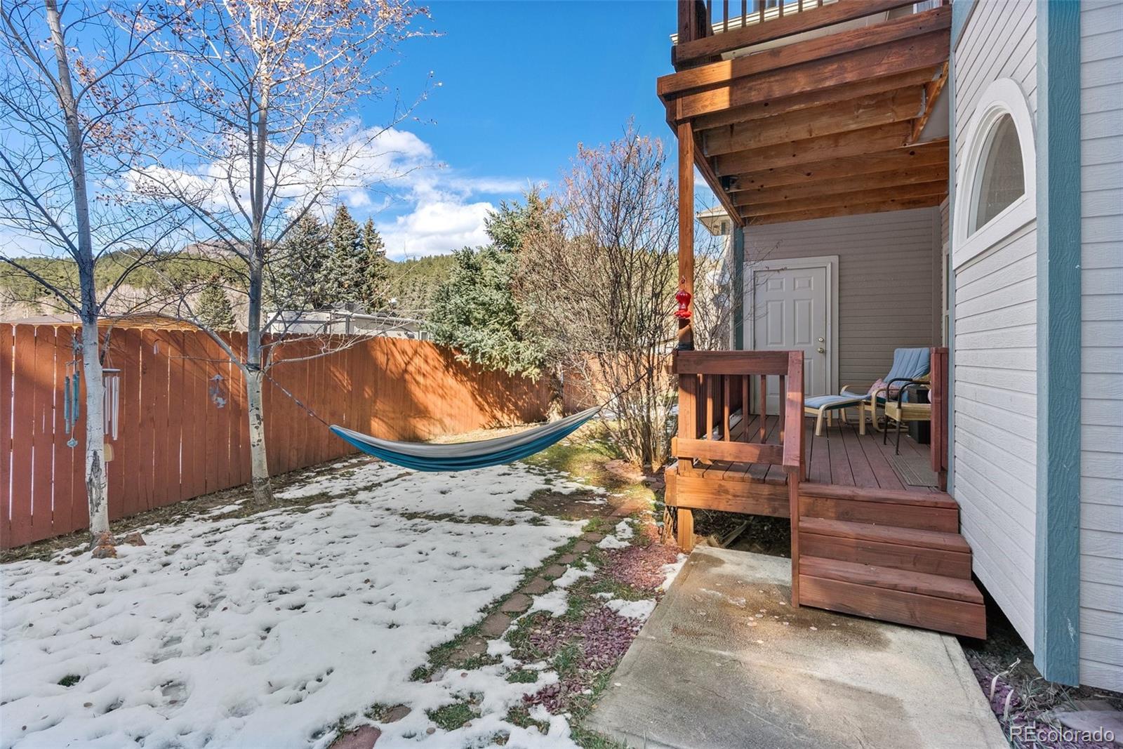 5720 County Road 64, Unit 101A Bailey, CO 80421 - Photo 26 of 46 a view of a backyard with sitting area