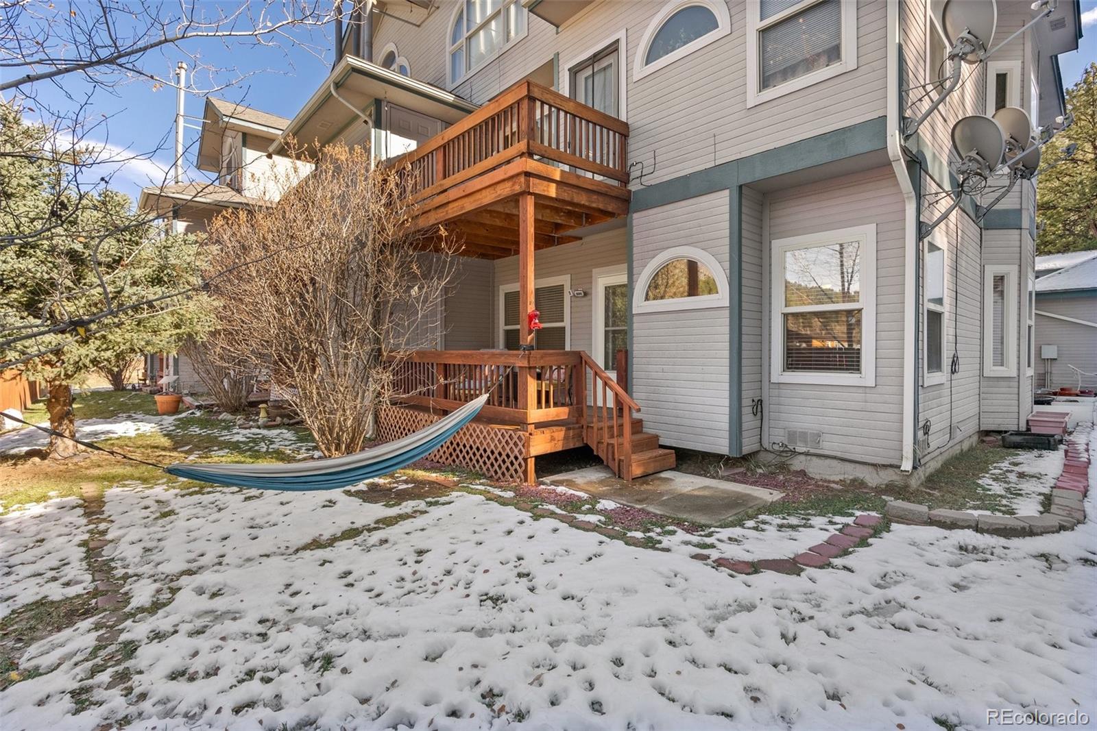 5720 County Road 64, Unit 101A Bailey, CO 80421 - Photo 28 of 46 a view of a house with a yard