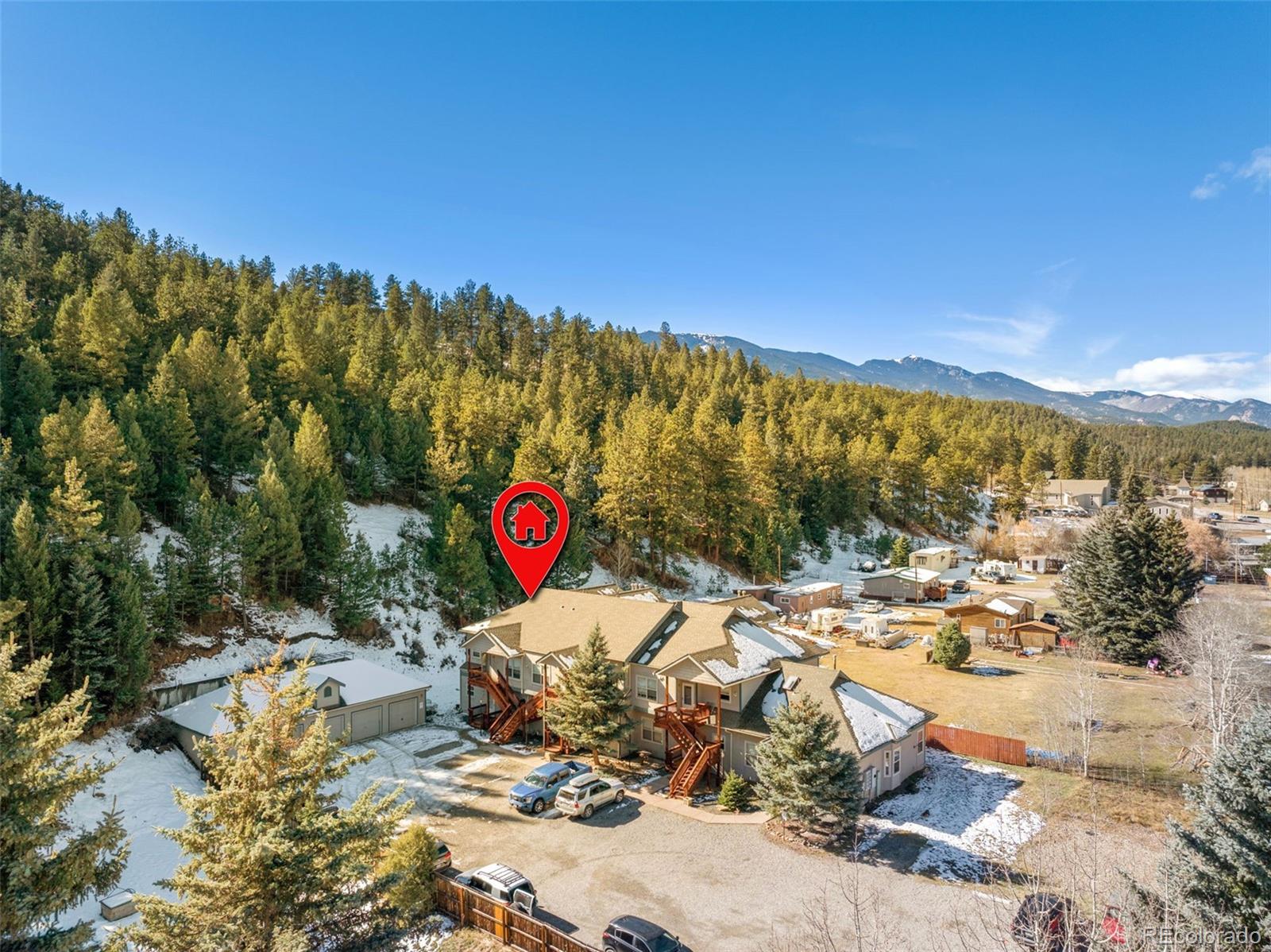 5720 County Road 64, Unit 101A Bailey, CO 80421 - Photo 31 of 46 a view of a city street sign and mountains