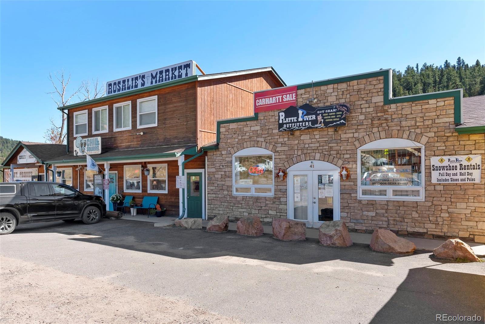 5720 County Road 64, Unit 101A Bailey, CO 80421 - Photo 38 of 46 a front view of a building with parking