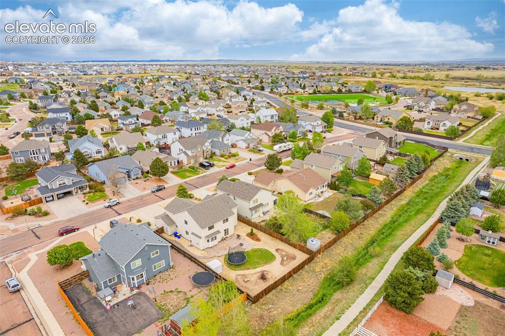 9127 Oakmont Road Peyton, CO 80831 - Photo 43 of 49 an aerial view of residential houses with outdoor space