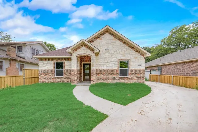 front view of a house with a yard