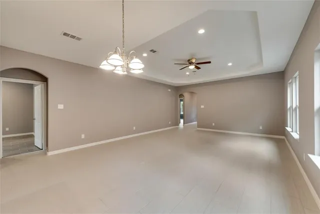 a large kitchen with a large window and stainless steel appliances