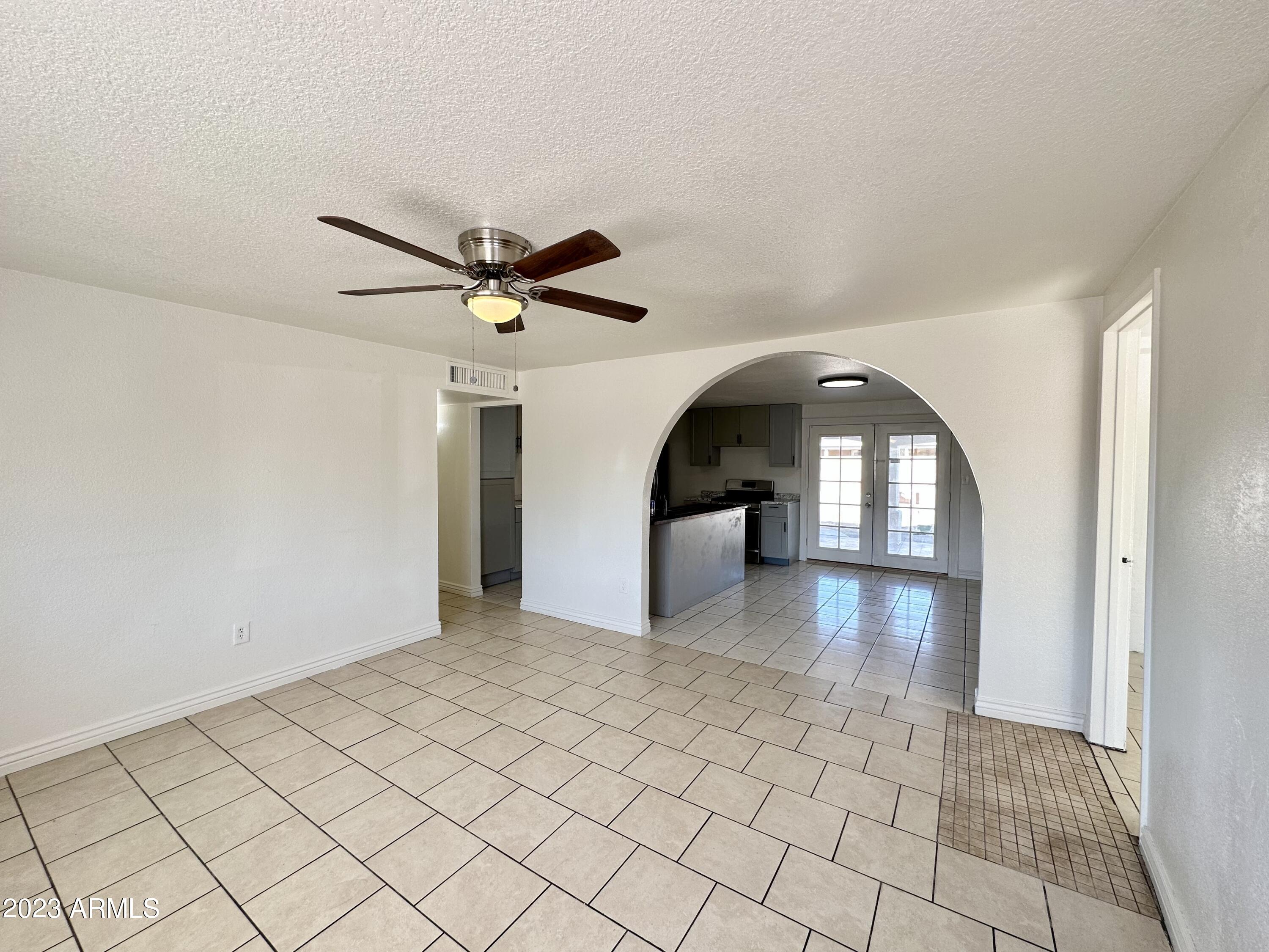 6242 West Coronado Road Phoenix, AZ 85035 - Photo 4 of 41 living room to kitchen view