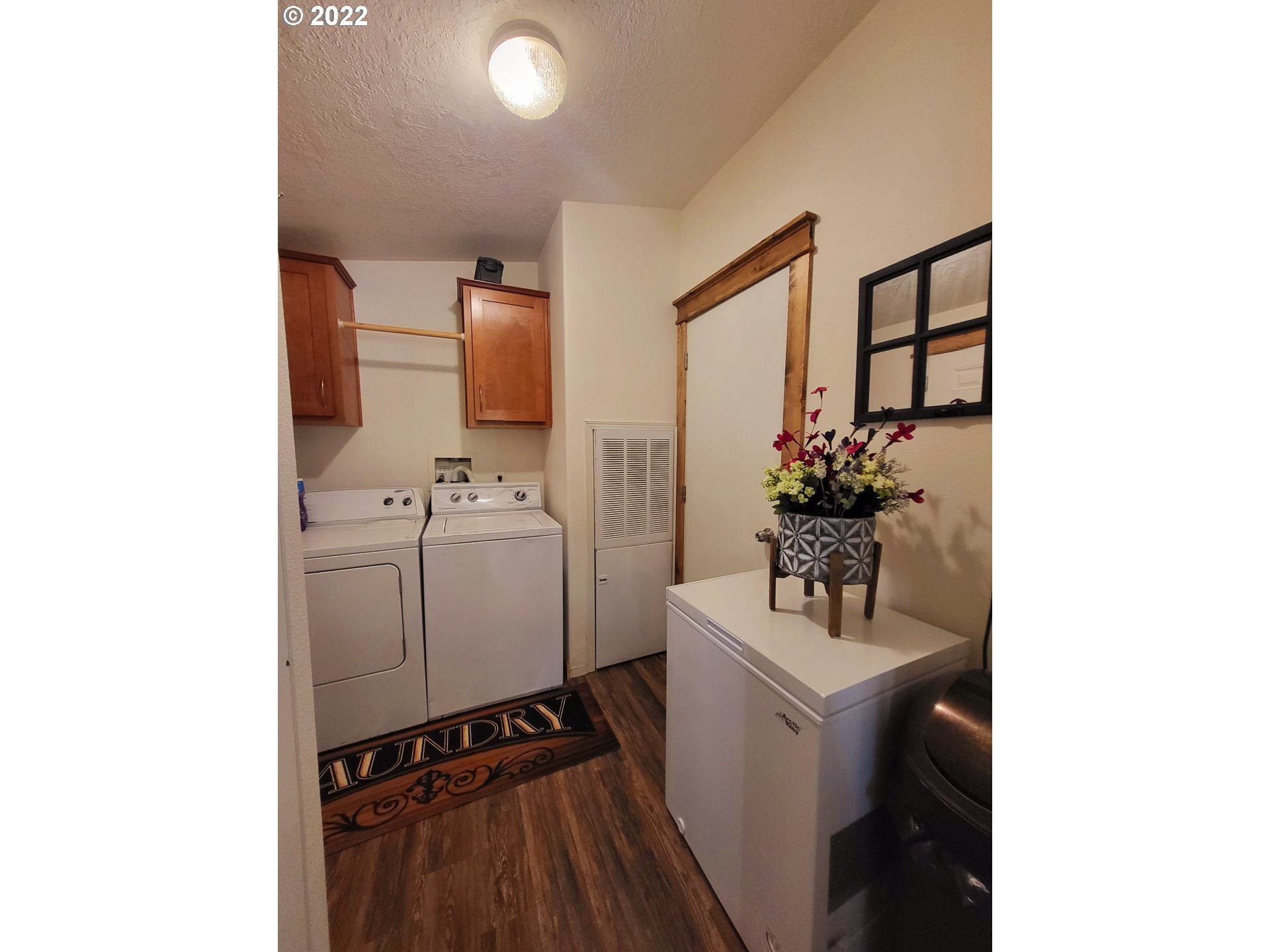 67506 East Bay Road North Bend, OR 97459 - Photo 10 of 31 a bathroom with a sink toilet and mirror