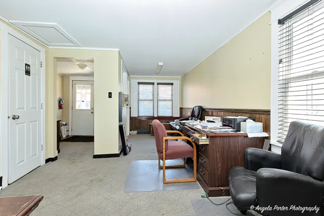 a work room with furniture and a window