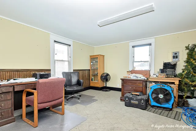 a bedroom with furniture and a wooden floor