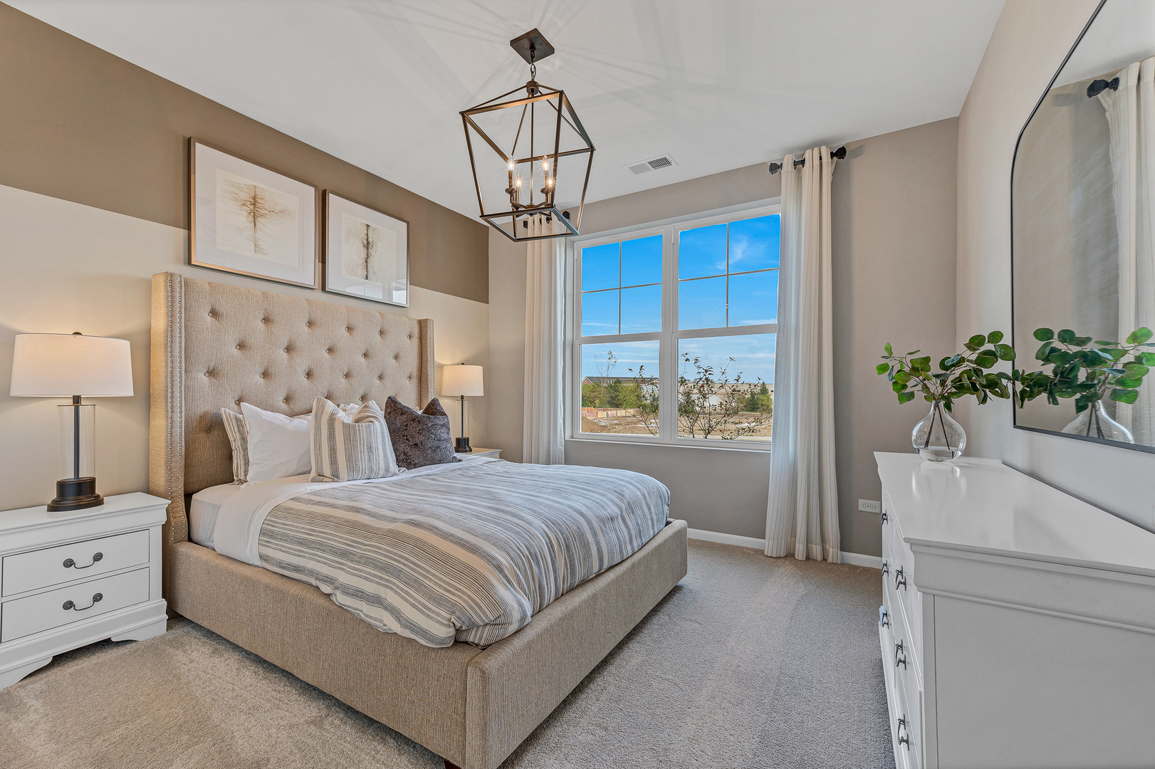 12456 Portrush Lane Lemont, IL 60439 - Photo 13 of 14 a bedroom with a large bed and a chandelier