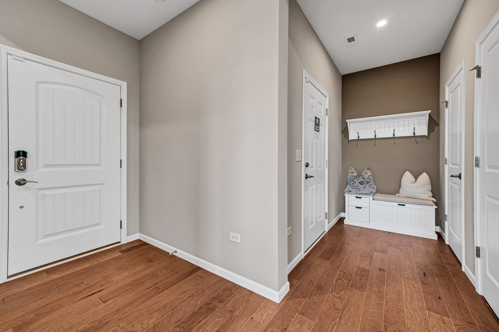 12456 Portrush Lane Lemont, IL 60439 - Photo 2 of 14 a view of a hallway with wooden floor