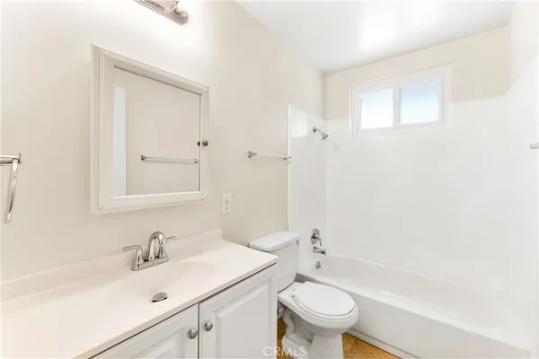 a bathroom with a sink a toilet and a bathtub