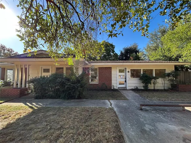 front view of a house with a patio