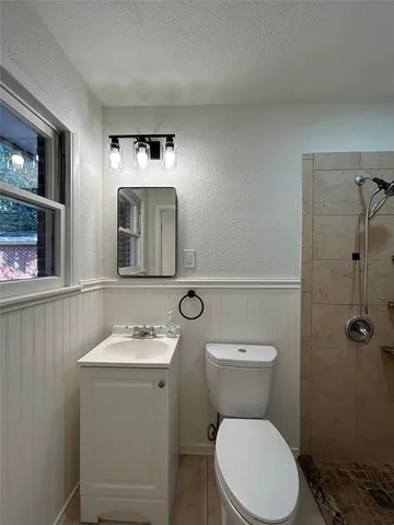 a view of an empty room and a window