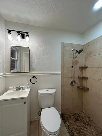 a view of a refrigerator in kitchen and wooden floor