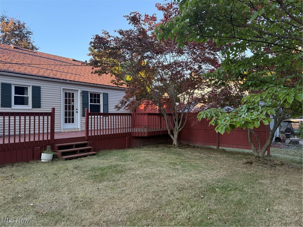 2520 Holgate Road Akron, OH 44313 - Photo 7 of 41 View of grassy yard with a wooden deck