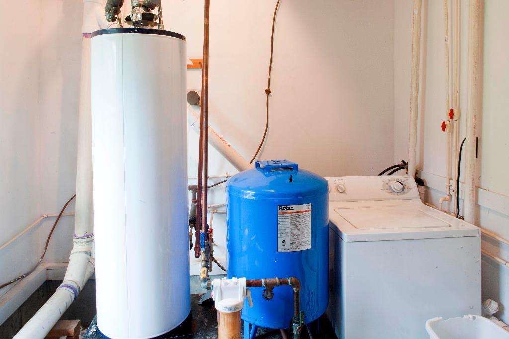 1223 Great Pond Road Aurora, ME 04408 - Photo 25 of 28 Utility room with propane hot water...