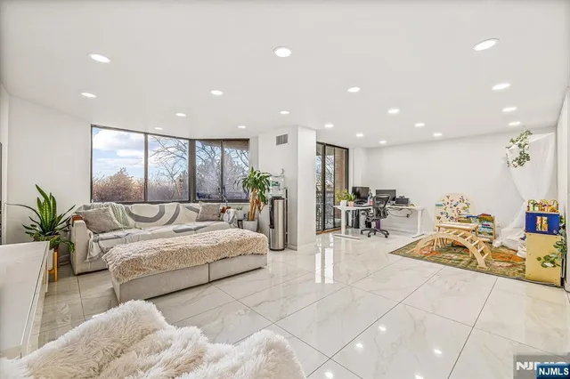 a living room with furniture and a table