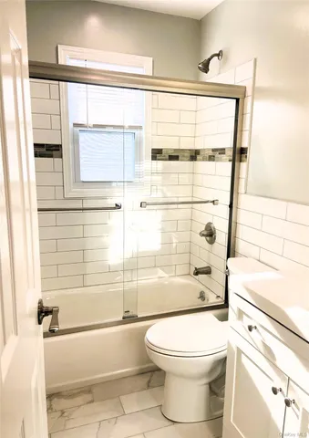 a bathroom with a toilet a sink and a bathtub