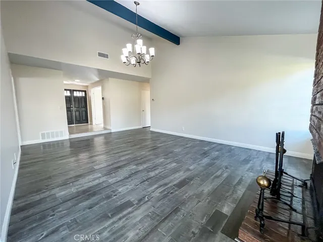 a view of a livingroom with furniture and chandelier