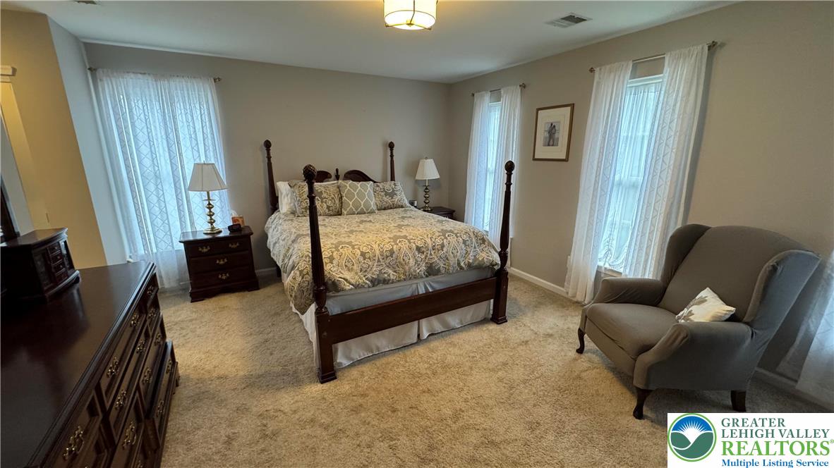 135 Clover Hollow Road Easton, PA 18045 - Photo 17 of 66 a bedroom with a bed and wooden floor