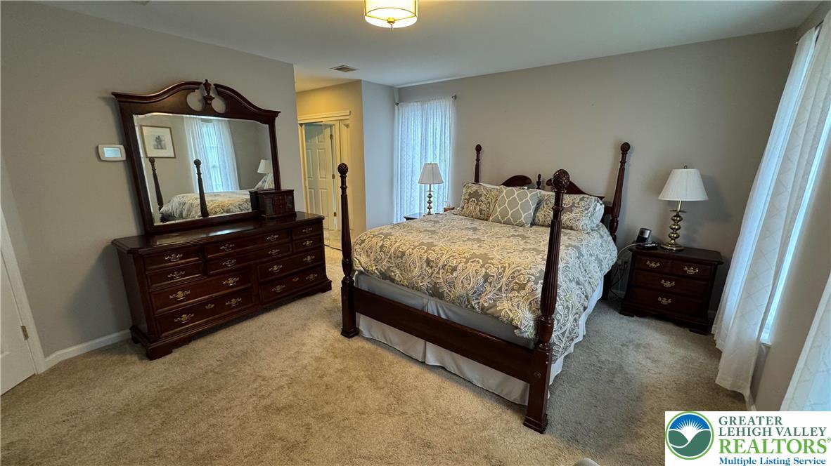 135 Clover Hollow Road Easton, PA 18045 - Photo 18 of 66 a bedroom with a bed and a mirror