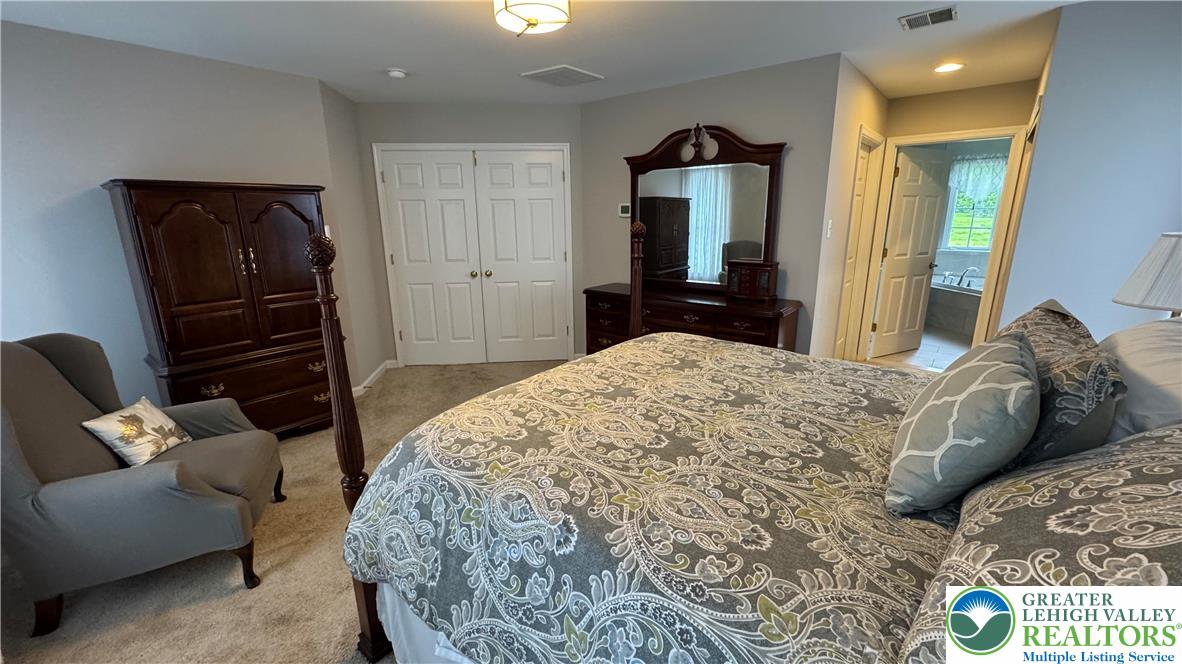 135 Clover Hollow Road Easton, PA 18045 - Photo 19 of 66 a bedroom with a bed and a television